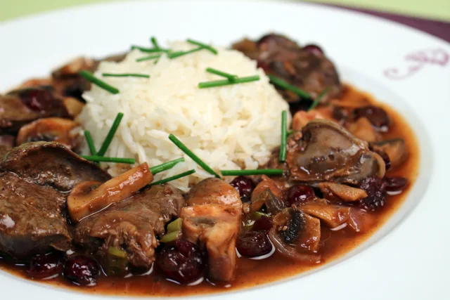 Chicken livers with mushrooms and cranberries in port sauce.