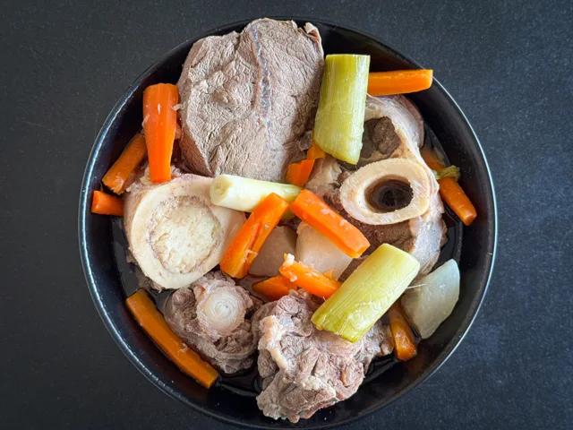 Beef pot-au-feu with vegetables and broth.