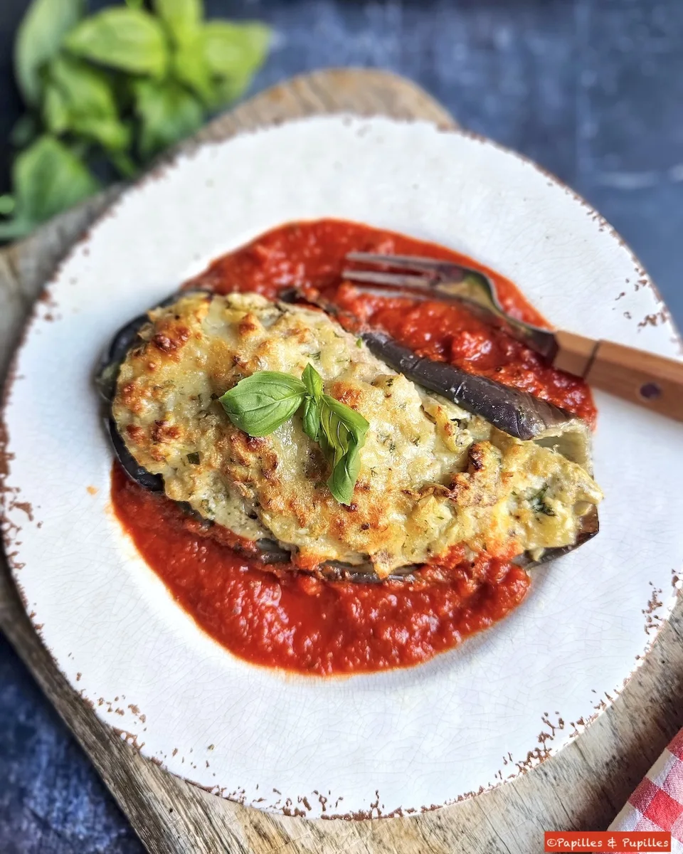 Cheese-stuffed aubergine served with tomato sauce.