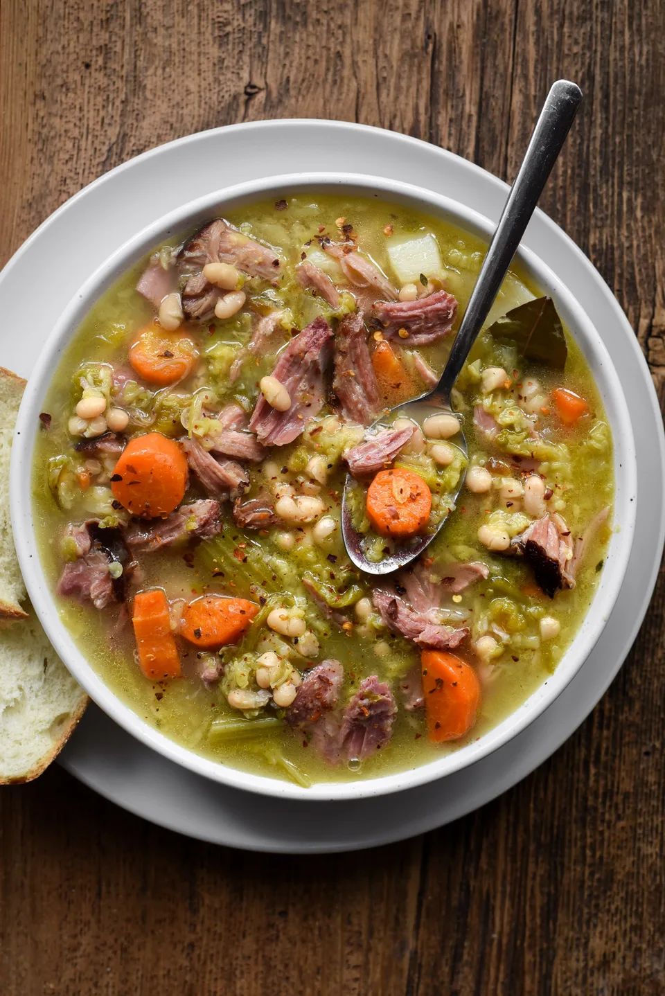 Garbure soup with beans, vegetables and meat.